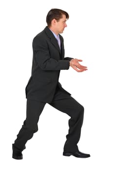 Young businessman pushing something with his hands on a white background