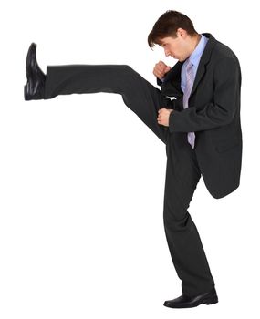 Businessman kicks up, isolated on a white background