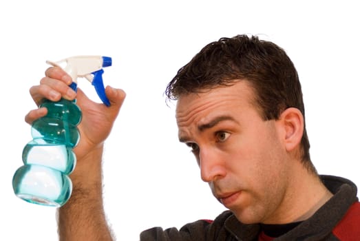 Young male using a water bottle to wet his hair