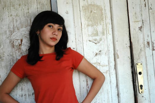 young beautiful asian girl wearing red shirt