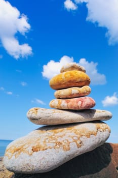 Pile of pebbles against the cloudy sky