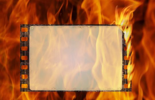 Burning old film frame in grunge style