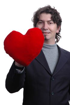 man holding a red heart in the hand. On white background