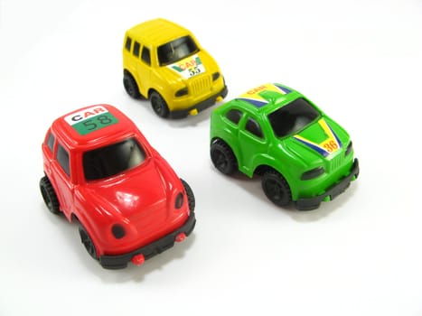 image of some rally toycars on a white background