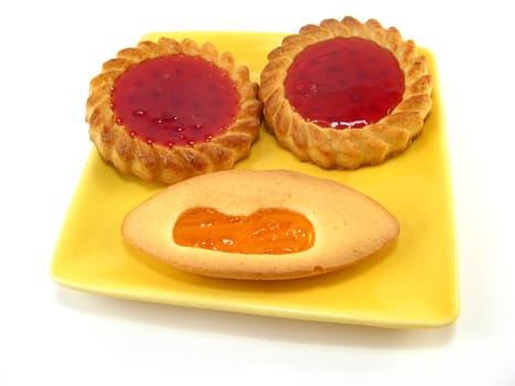 some biscuits on a plate over a white background
