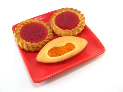 some biscuits on a plate over a white background