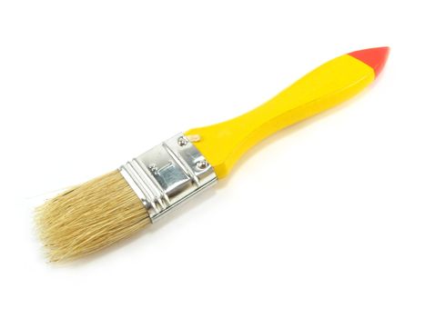 a yellow paintbrush over a white background