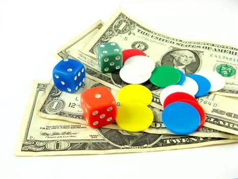 dices,tokens and dollars over a white background