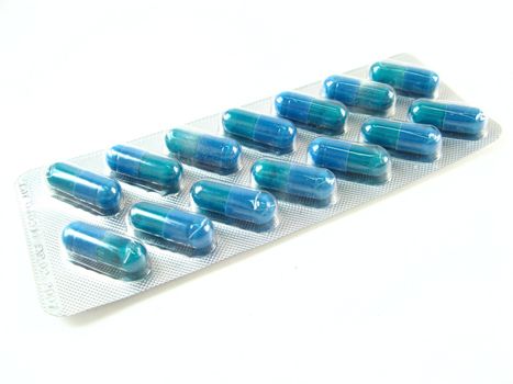 some blue pills over a white background