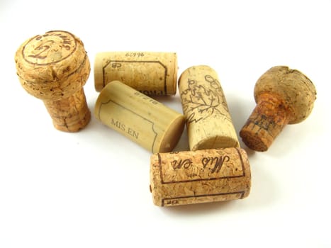 some corks of wine bottles over a white background