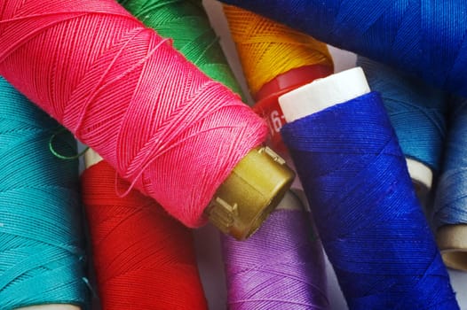 Close up of colored thread spools
