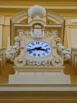 a clock on the city hall frontage