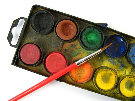 brush and watercolor box on a white background