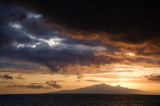 Sunset over Pacific Ocean and Kihea island in Maui, Hawaii, USA.