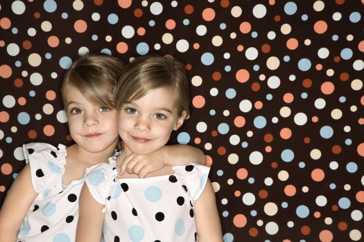 Female children Caucasian twins looking at viewer.