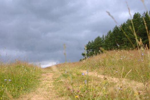 Footpath for horizon removed against heavy rain clouds