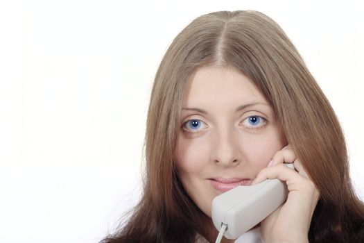 The girl speaking by phone and looking downwards