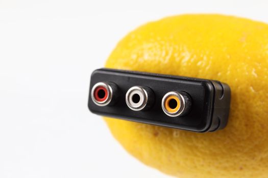 Lemon with scart connection removed on a white background without isolation