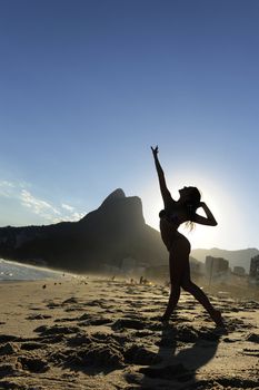 beautiful dancer performing on the beach, Rio de Janeiro
