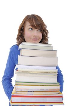 young student carrying a heavy stack of books