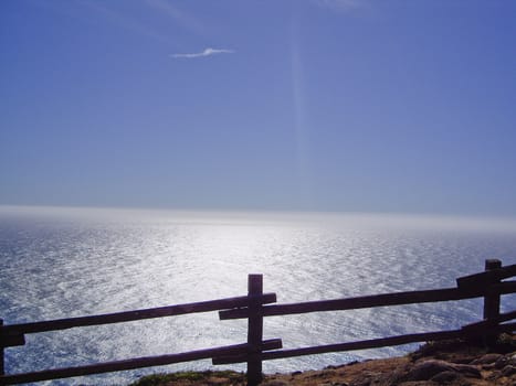 Ocean view at rails of Pacific Ocean at dusk