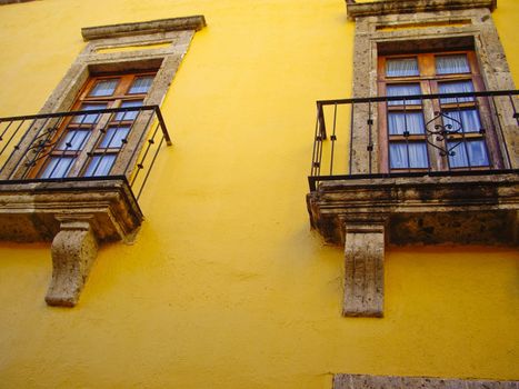 Colonial windows on yellow wall