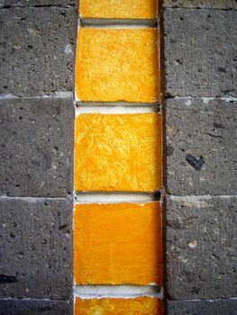 Detail of yellow and gray stone walls