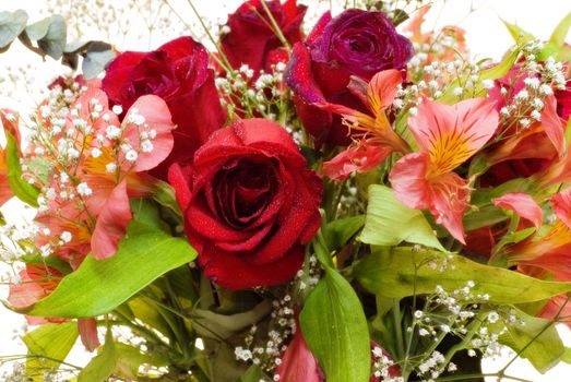 Close-up view of a vibrant bouquet of roses and lily's