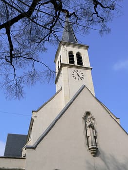 church and tree and sky blue