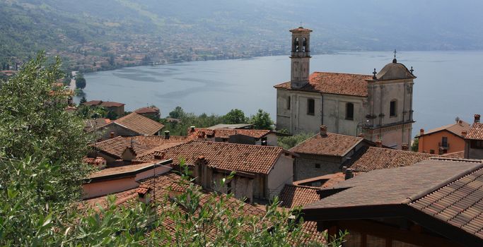 View on small village Sale Marasino with church