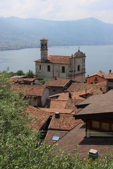 View on small village Sale Marasino with church