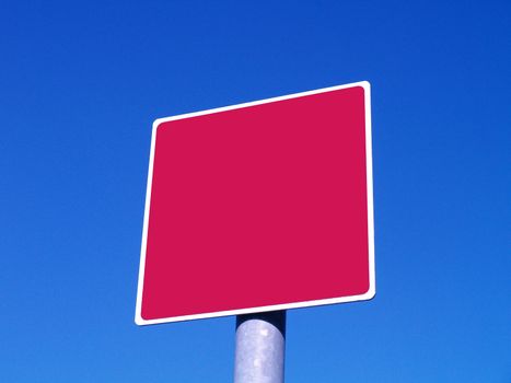 red sign and blue sky