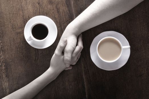 Concept of male and female hands, love and coffee              