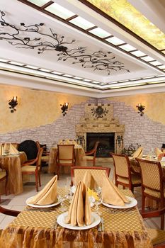 Spacious restaurant with the big fireplace 
