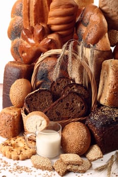 A lot of different bread on a white background
