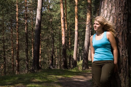 Young beautiful blonde in a forest