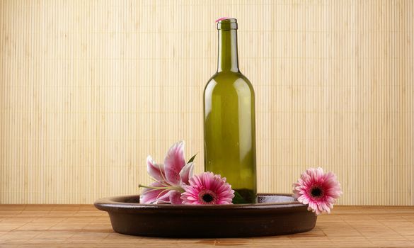 Bottle of massaging oil over spa background           