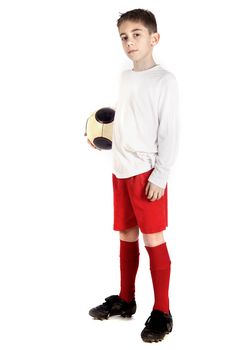 a boy in football uniform holding a football