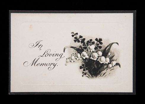 An antique In Memorium card with Lily of the Valley design.