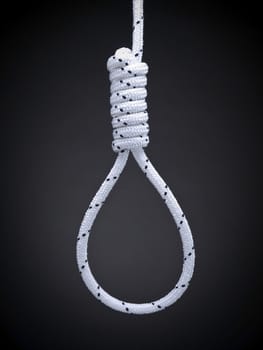 A hangman's noose over a gray background.