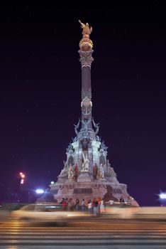 night shot of a tall Monument to Christopher Columbus Spain