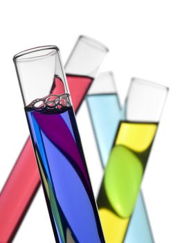 Four test tubes filled with colored liquids. Isolated on white.