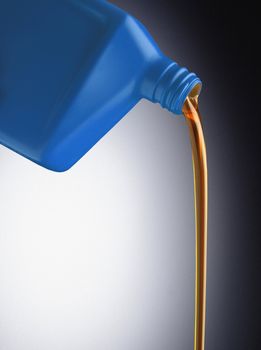 motor oil pouring out of blue plastic bottle