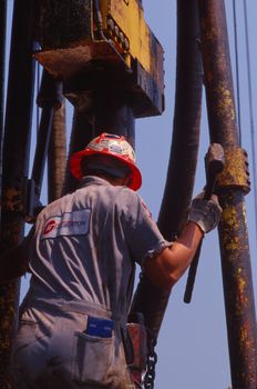 roughneck on drilling platform
