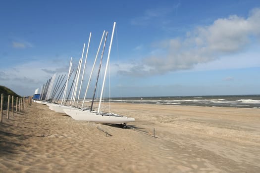 Sailing boats on the beach along the Dutch coast