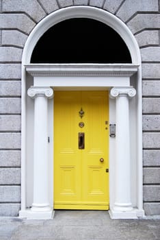 Georgian style yellow wooden door in house