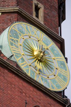 Old styled brick tower clock - sundial