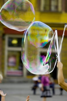  Blowing giant bubbles (street photo)

