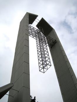 a big cross structure outside of a church