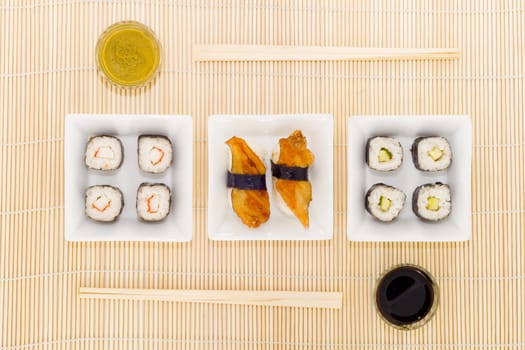 a plate with different kinds of sushi